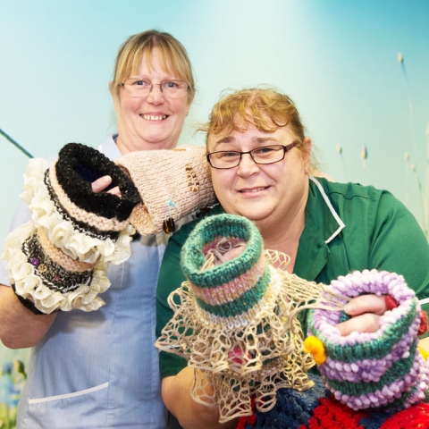 Farndale Ward colleagues Helen Herbert, Registered Nurse, and Rachel Hullah, Care Support Worker, show off the Twiddle Muffs