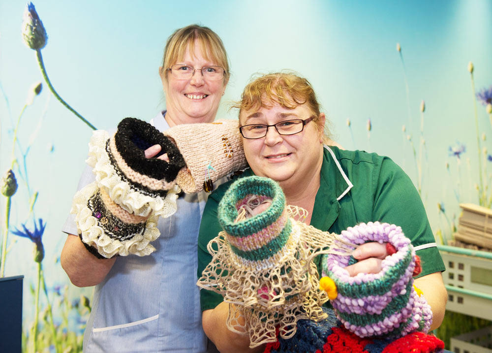 Farndale Ward colleagues Helen Herbert, Registered Nurse, and Rachel Hullah, Care Support Worker, show off the Twiddle Muffs