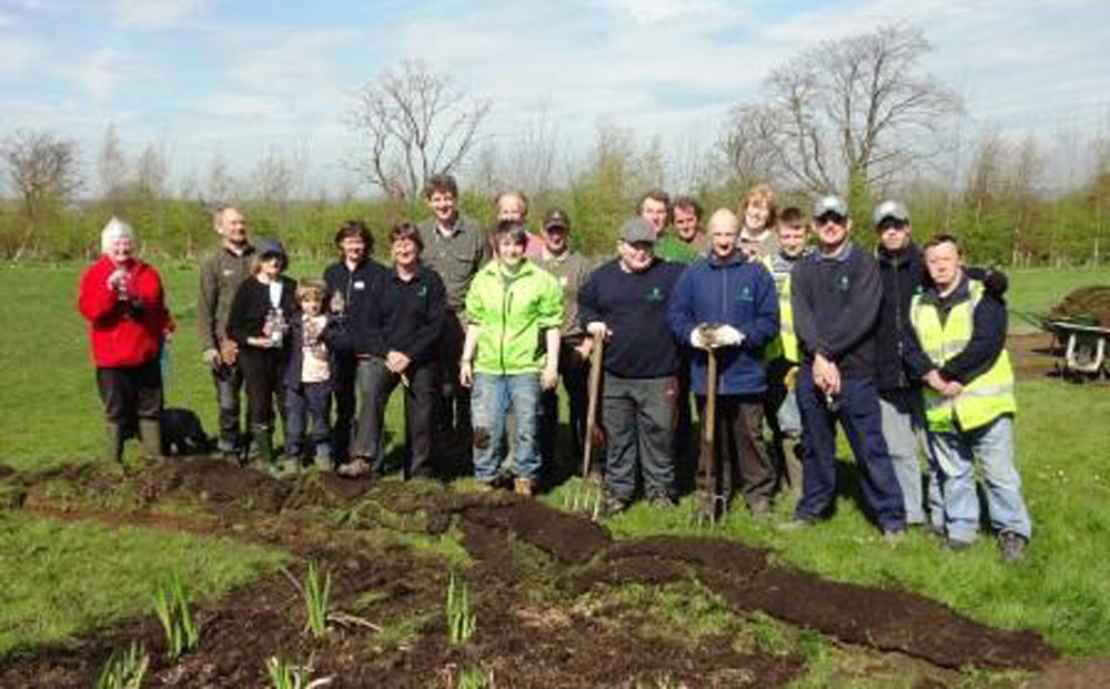 Volunteers planting on Irongate Field