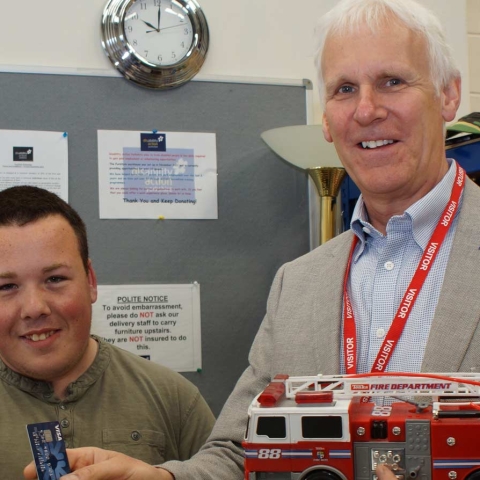 Retail Therapy! Disability Action Yorkshire trainee Kalum Takacs holds the card reader funded by County Coun John Ennis