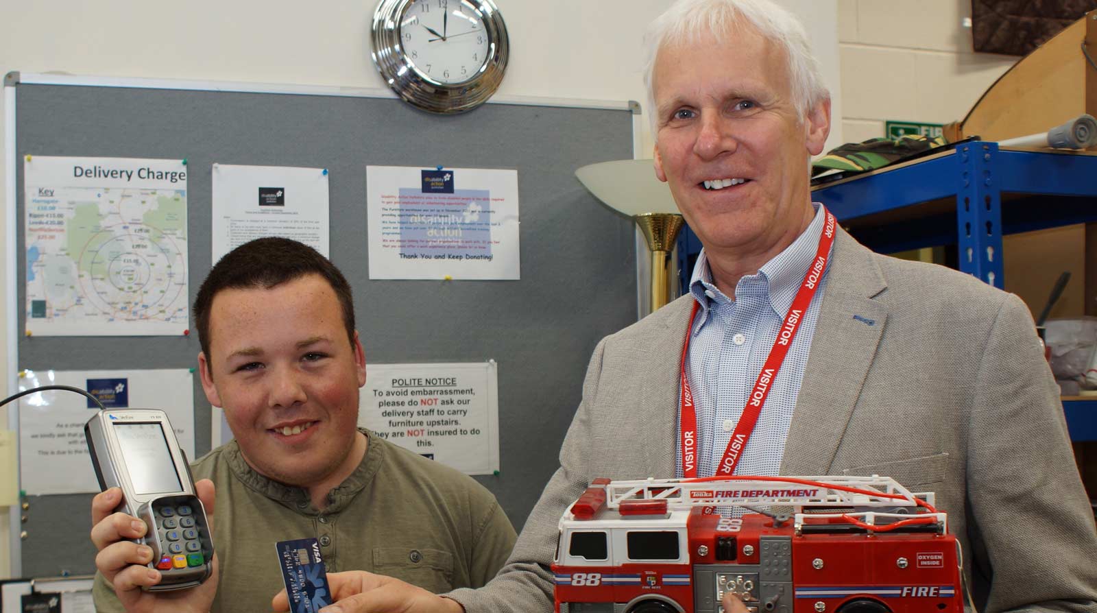 Retail Therapy! Disability Action Yorkshire trainee Kalum Takacs holds the card reader funded by County Coun John Ennis