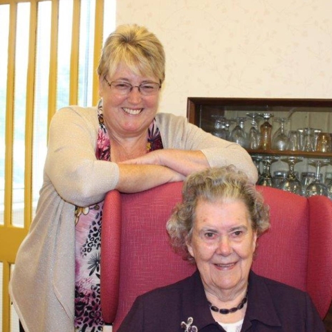 Jane Watson (standing) and RNIB Tate House resident Dorothy (seated)