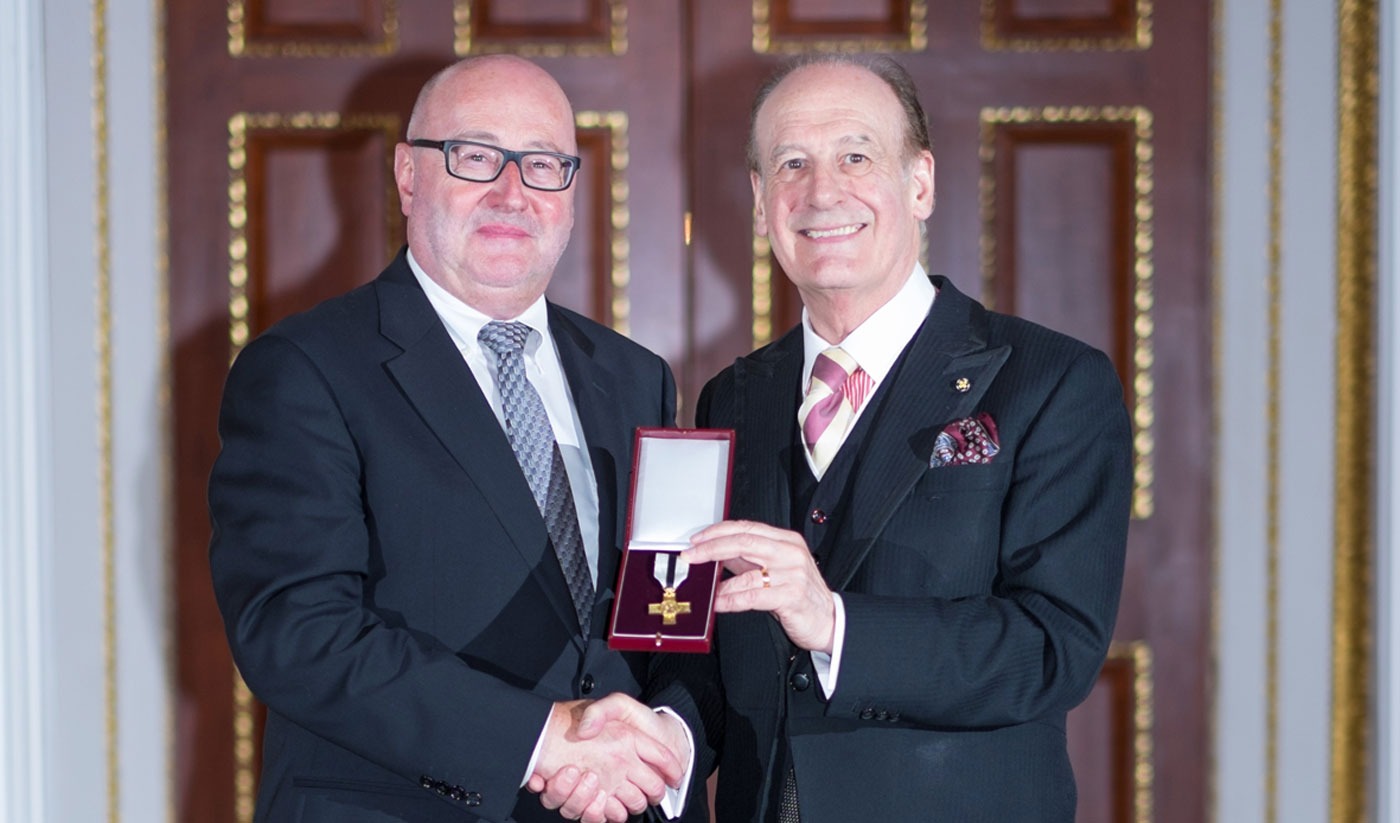 Peter McCormick OBE, left, receives the Order of Mercy from Lord Lingfield