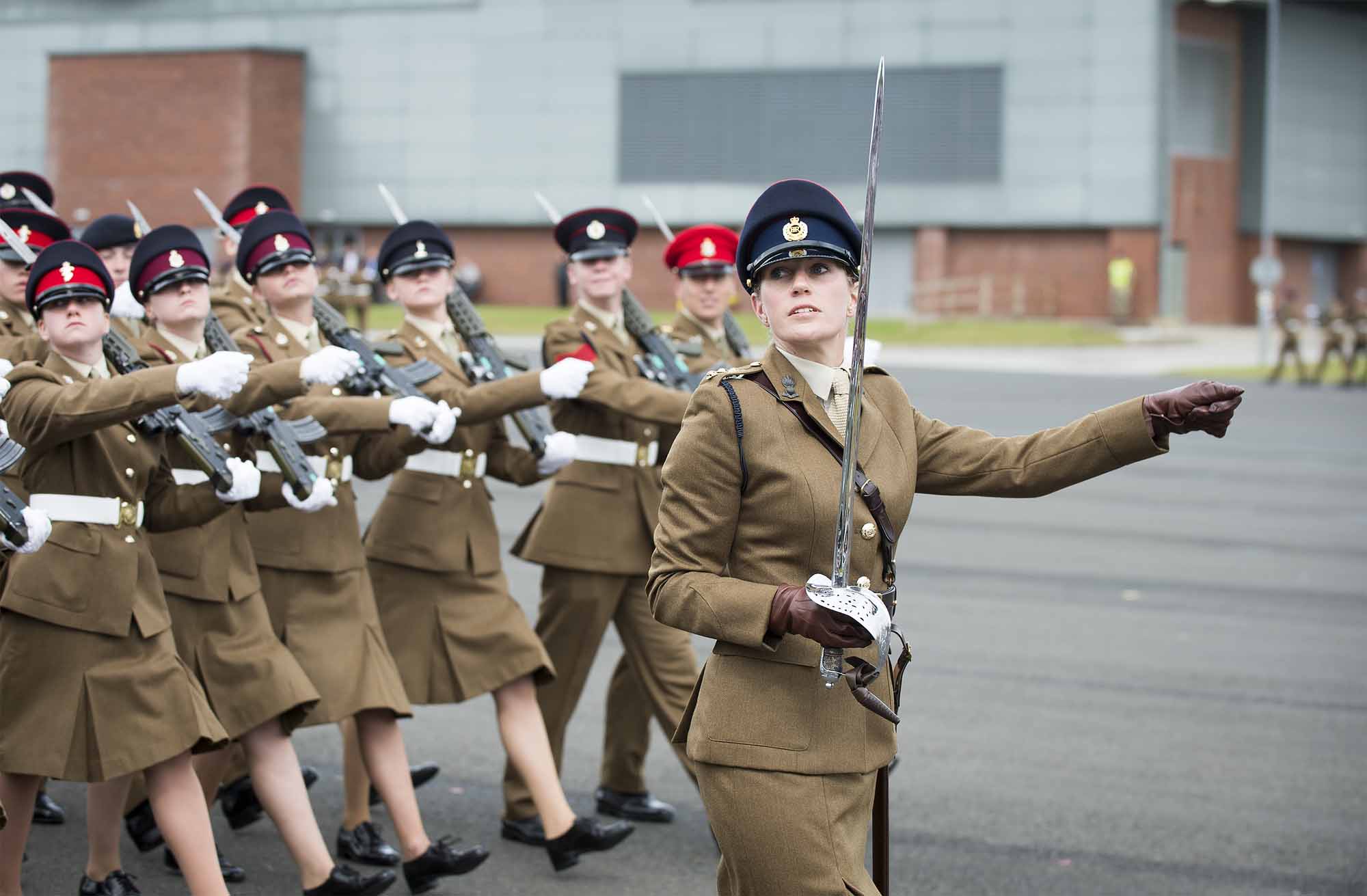 Pictured:Captain Ruth Cork leading her platoon of Junior Soldiers past the crowds and saluting officer.  More than 600 teenagers from the Army Foundation College marched on their way to a new career when they graduated from the military training establishment in Harrogate, North Yorkshire. The college in Penny Pot Lane, Harrogate runs two types of course – a 40-week long course and a shorter 20-week course to train 16-17 year olds for a wide variety of Army careers. NOTE TO DESKS:  MoD release authorised handout images.  All images remain Crown Copyright 2016.  Photo credit to read -Sgt Jamie Peters RLC (Phot) Email: jamiepeters@mediaops.army.mod.uk richardwatt@mediaops.army.mod.uk shanewilkinson@mediaops.army.mod.uk Richard Watt - 07836 515306 Shane Wilkinson - 07901 590723