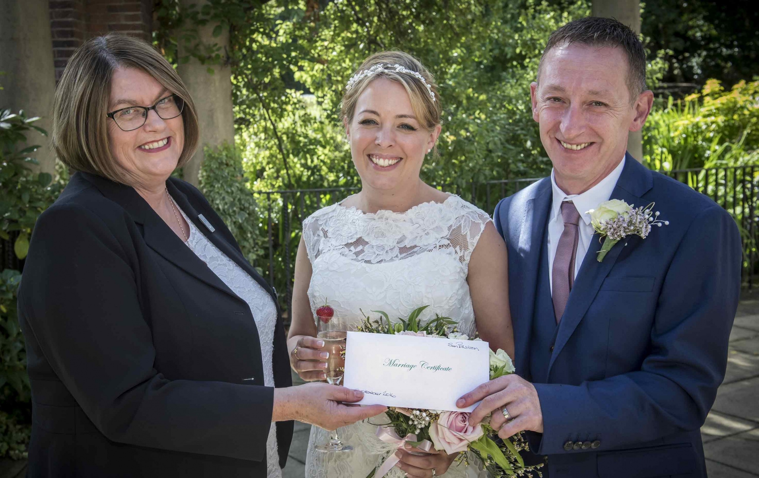 Superintendent Registrar Sue Lewis, left, with newlyweds Alison Towers and Steven Burns at the Sun Pavilion in Valley Gardens, Harrogate