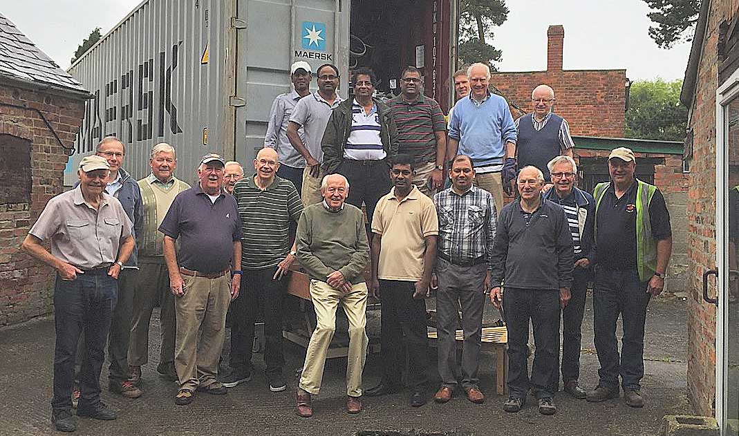 PhysioNet volunteers with a 40 container ready for shipping to SrI Lanka in July
