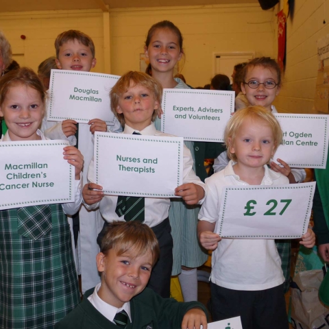 The photo shows volunteer Rosie with Brackenfield pupils who explained that the money raised will go towards funding a local MacMillan nurse that costs £26 an hour.