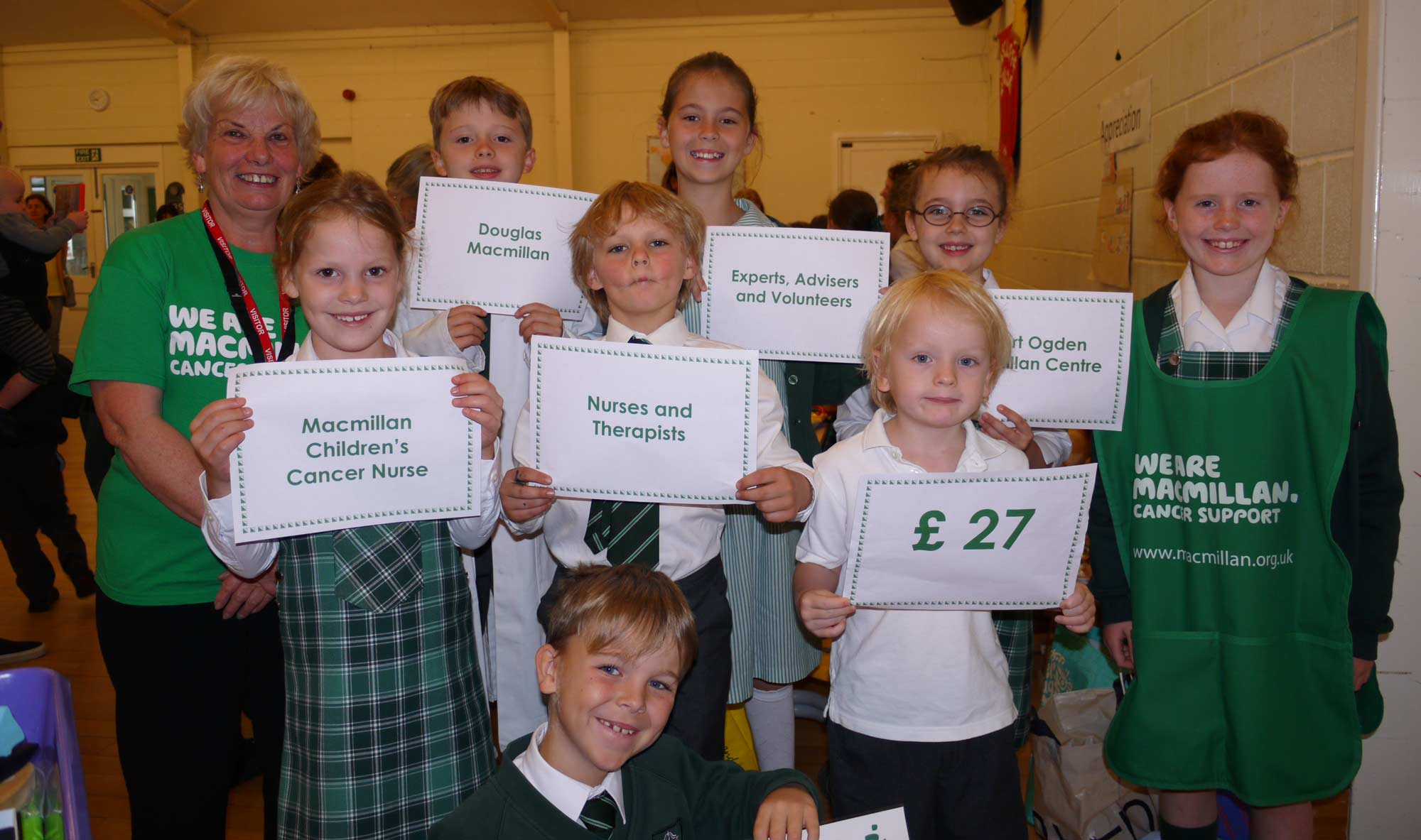 The photo shows volunteer Rosie with Brackenfield pupils who explained that the money raised will go towards funding a local MacMillan nurse that costs £26 an hour.