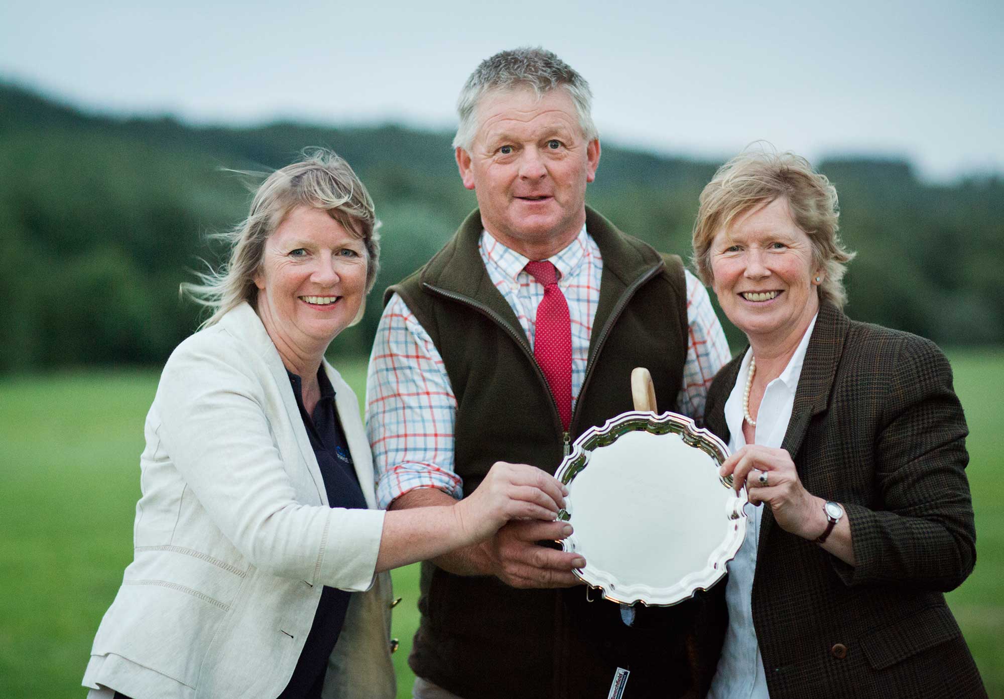 TRAIL PLEASE! Pictured (L to R) presenting the trophy in memory of sheepdog trialist, Jack Hollows, are: PB Curran operations director, Linda Pepper, winner Jed Watson and Gena Douglas