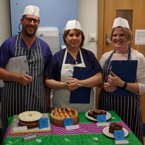 Sampling the delights - Staff play the part of Bake Off judges in best cake competition