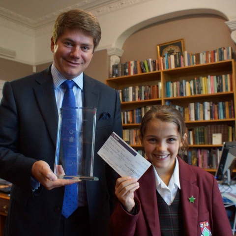 Gas Cheque! Competition winner Eleanor Grattoni-May presents the cheque to Ashville College Headmaster Mark Lauder