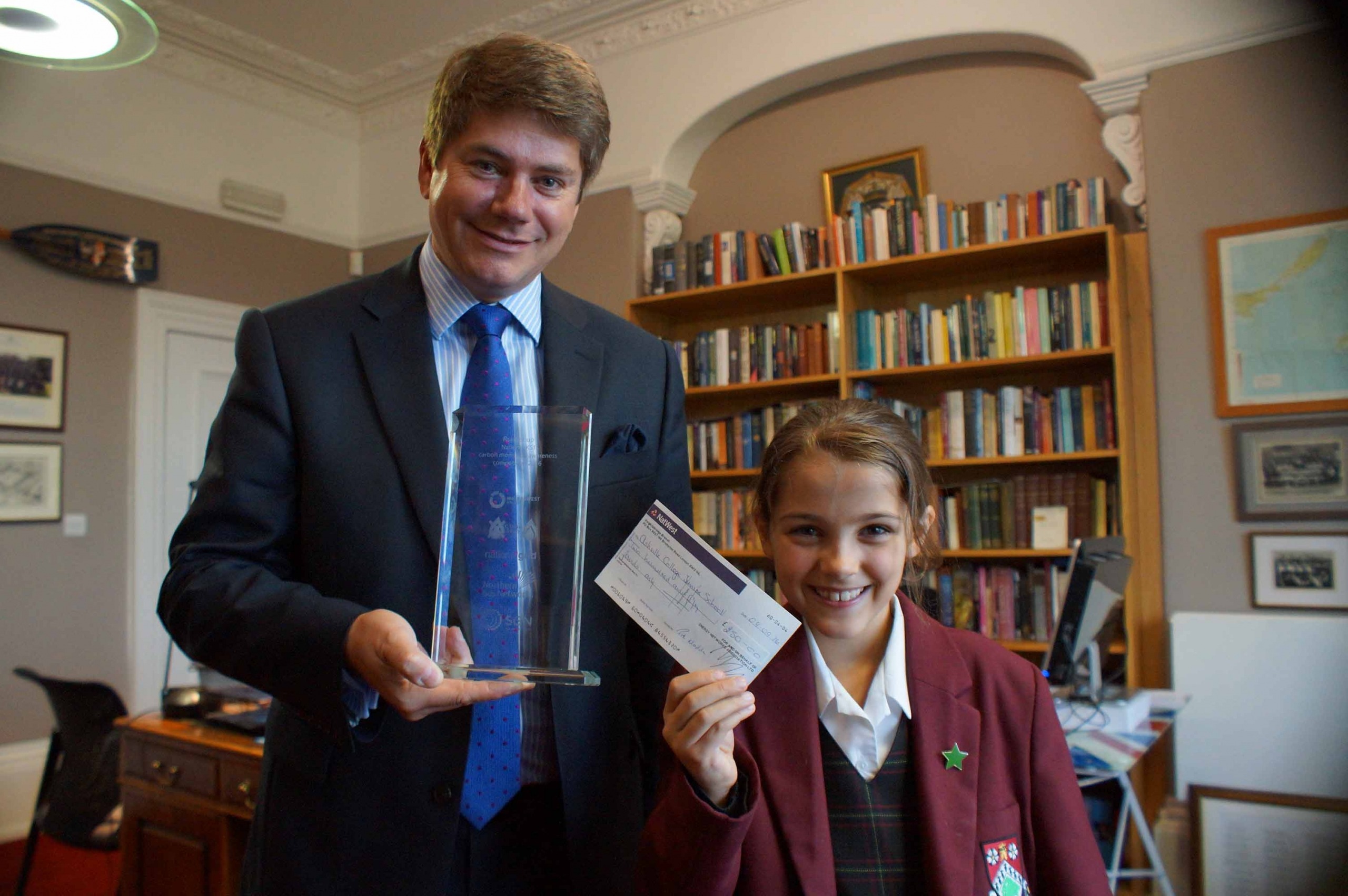 Gas Cheque! Competition winner Eleanor Grattoni-May presents the cheque to Ashville College Headmaster Mark Lauder