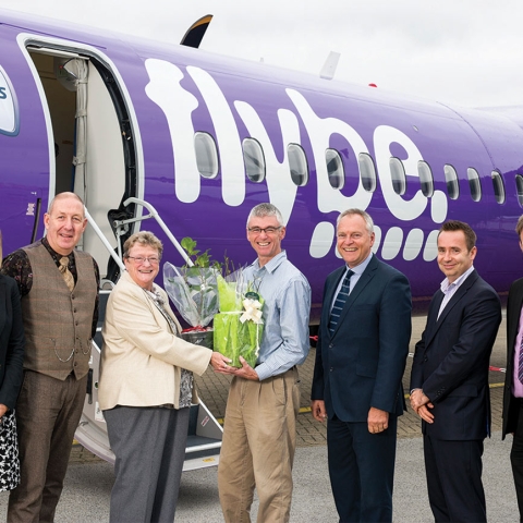 Judith Donovan swaps plants with Gordon Seabright of the Eden Project on the apron at Cornwall Airport Newquay. With (L-R) Kayley Worsley, Nigel Eaton, Paul Willoughby, Al Titterington and Adam Paynter