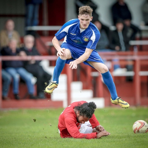 Ryan Sharrocks goes over his opponent rather than around - during Railway's 2-1 loss away to Thackley
