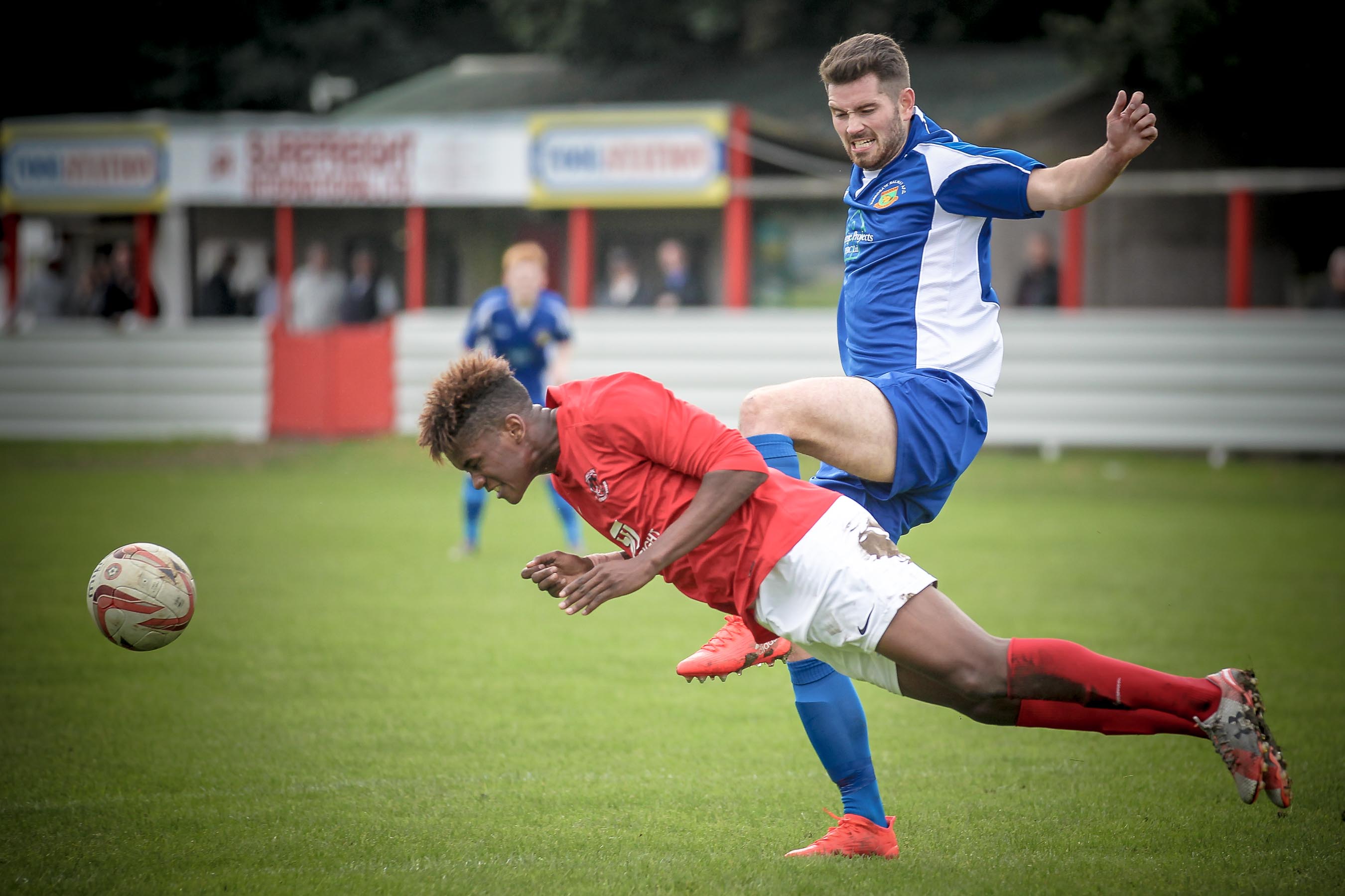 Thackley defender gets a header in as Greg Kidd pulls out from the challenge.