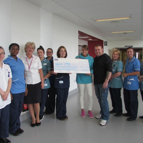 Staff on the oncology ward, J93, at St James’s collect the generous donation from Vickie Spokes and her partner, Neil