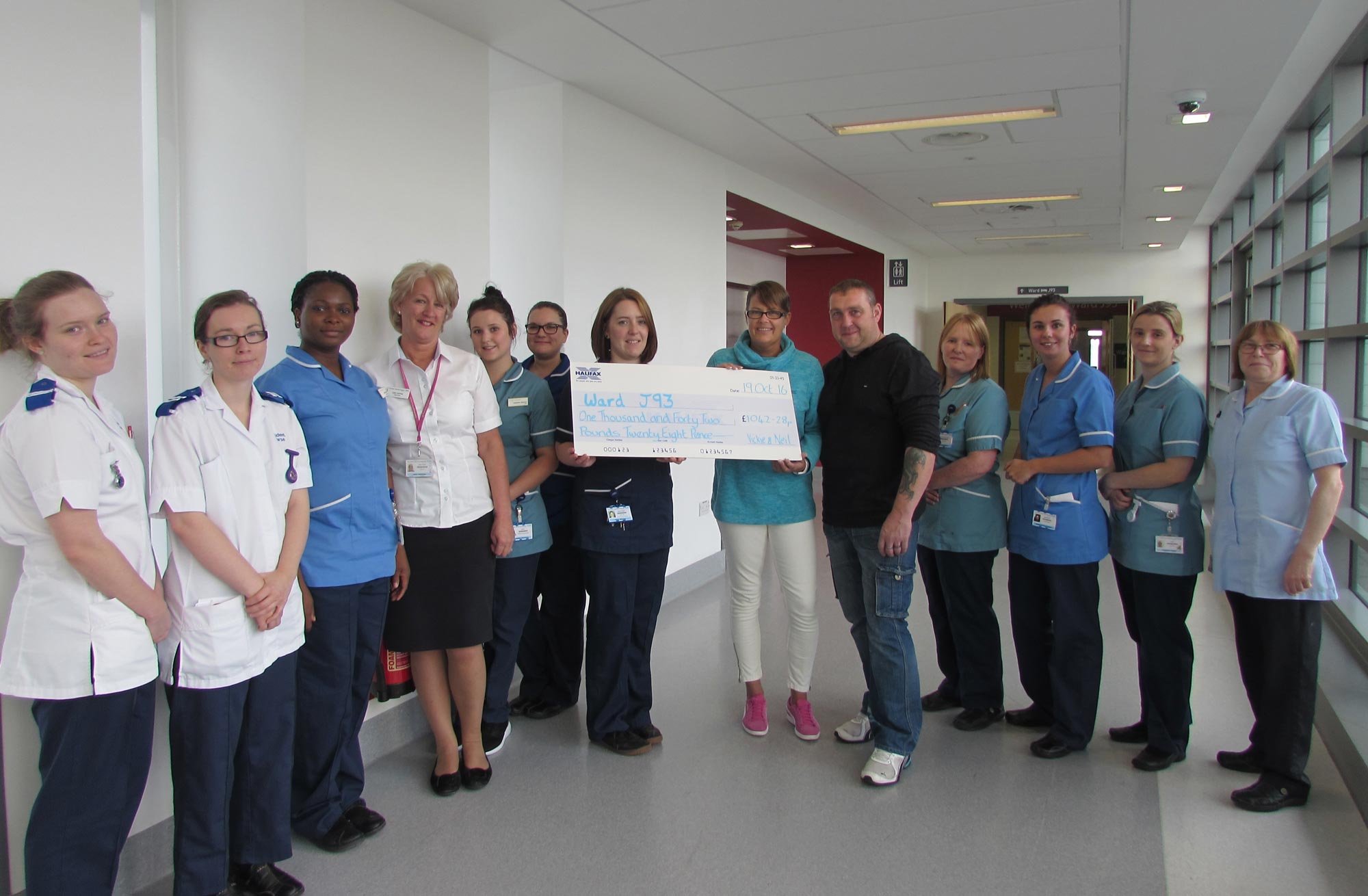 Staff on the oncology ward, J93, at St James’s collect the generous donation from Vickie Spokes and her partner, Neil