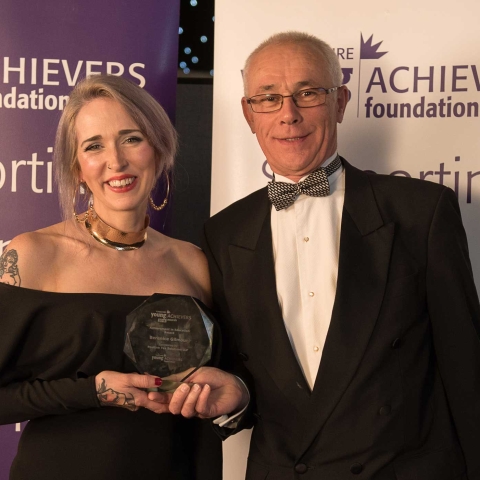 Berenice Gilmour receives the Achievement in Education Award from sponsor Stephen Burwood of Positive Tax Solutions