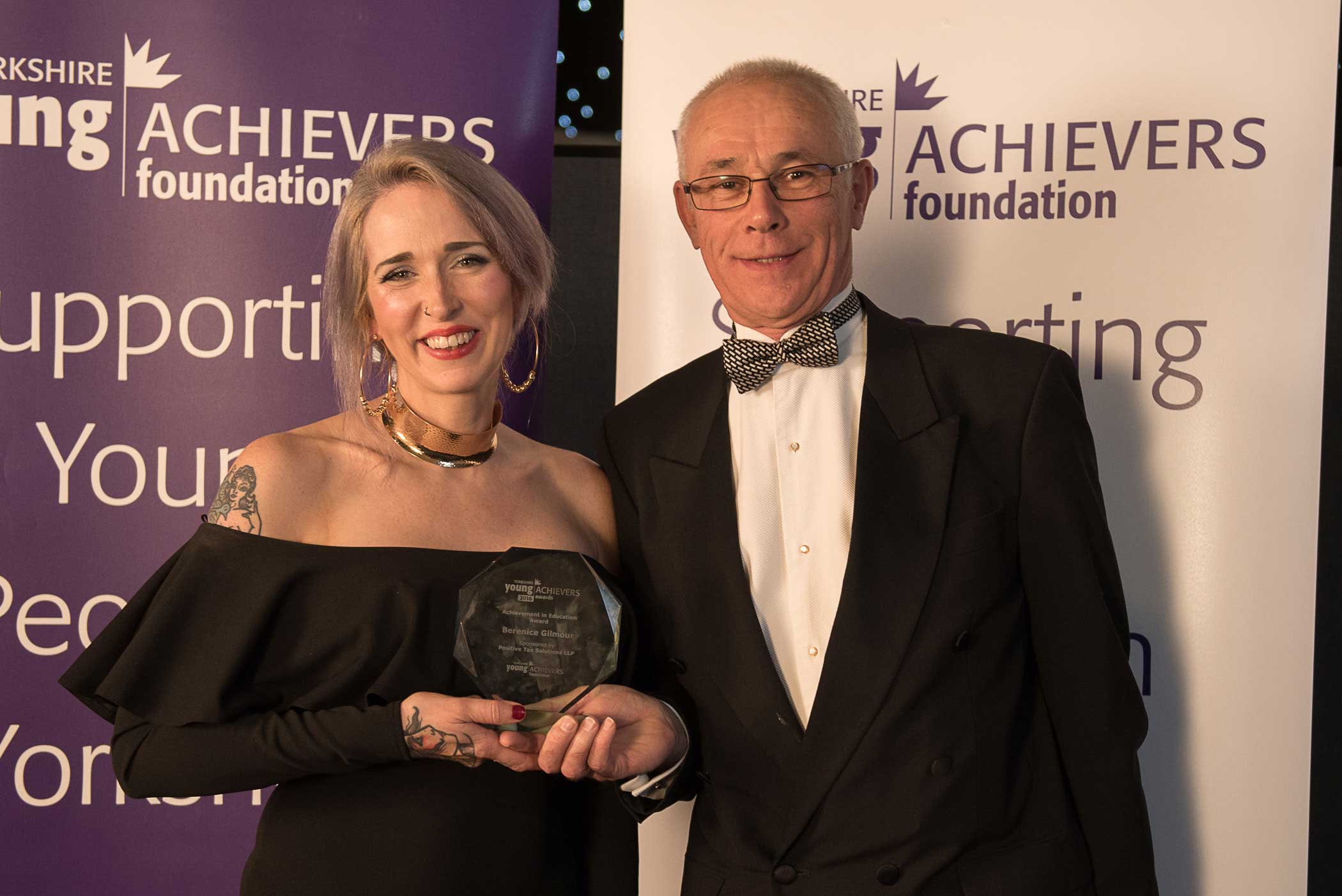 Berenice Gilmour receives the Achievement in Education Award from sponsor Stephen Burwood of Positive Tax Solutions