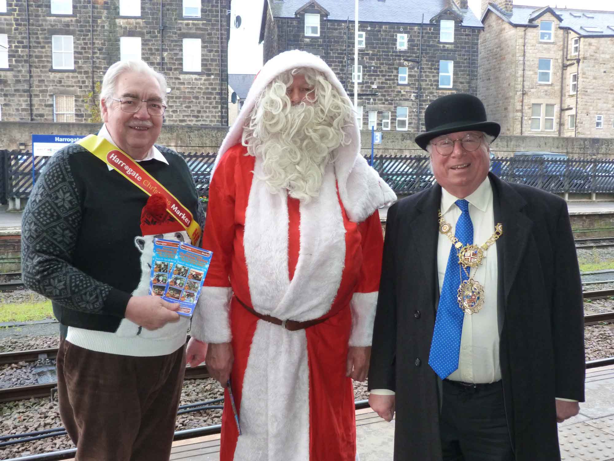 Market Maker Mike Edward, Santa, and the Mayor of Harrogate Coun Nick Brown prepare to welcome visitors on the Virgin Trains East Coast Christmas Market Specials to Harrogate