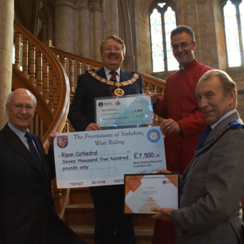 Rt W Bro David S Pratt (centre) with the Dean of Ripon Cathedral, The Very Rev John Dobson (left) and stone mason Wayne Denny