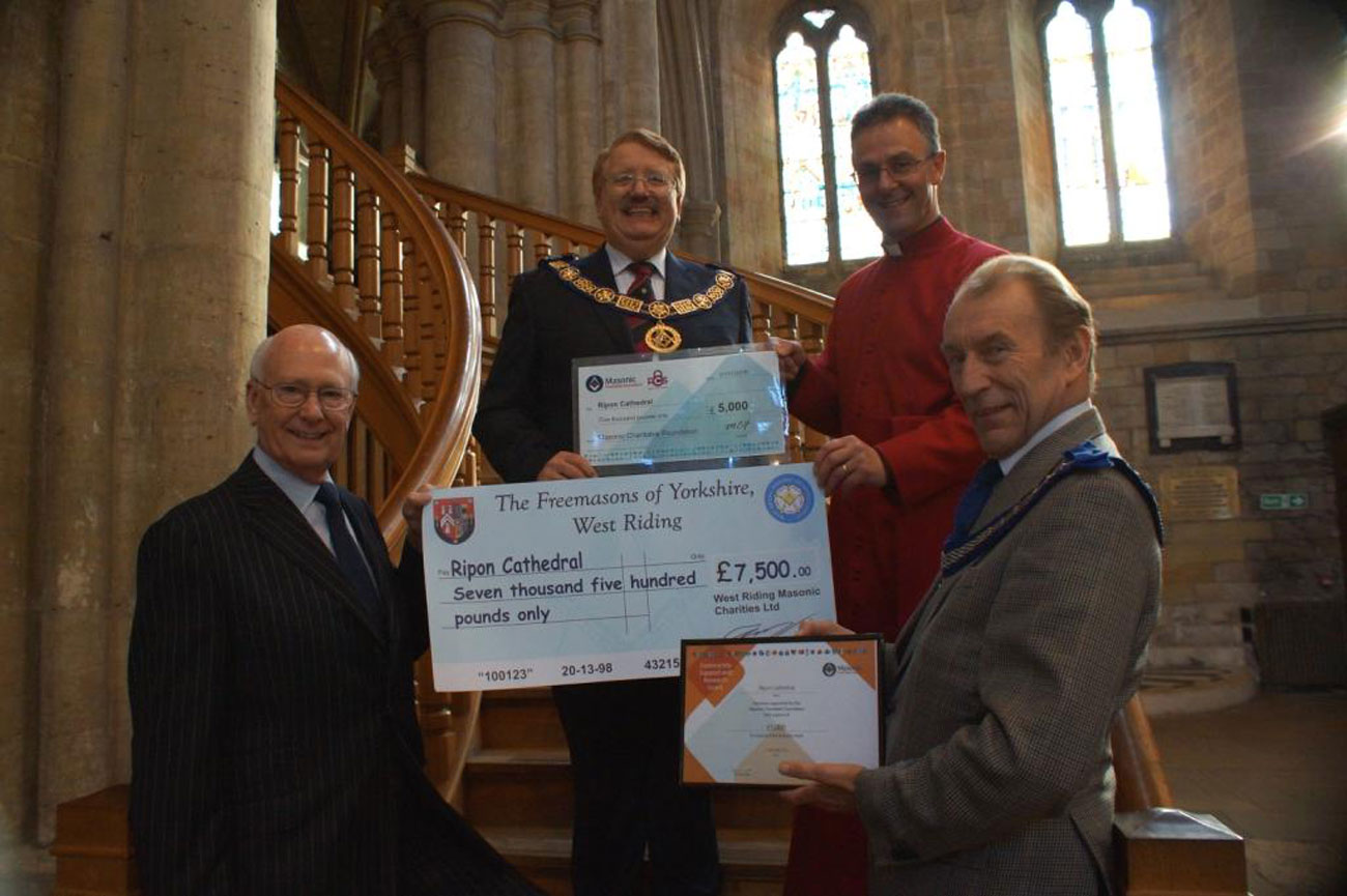 Rt W Bro David S Pratt (centre) with the Dean of Ripon Cathedral, The Very Rev John Dobson (left) and stone mason Wayne Denny