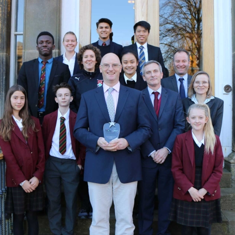 National Award! Ashville College Senior Housemaster Gilmour Coad, centre front, with boarding pupils and staff