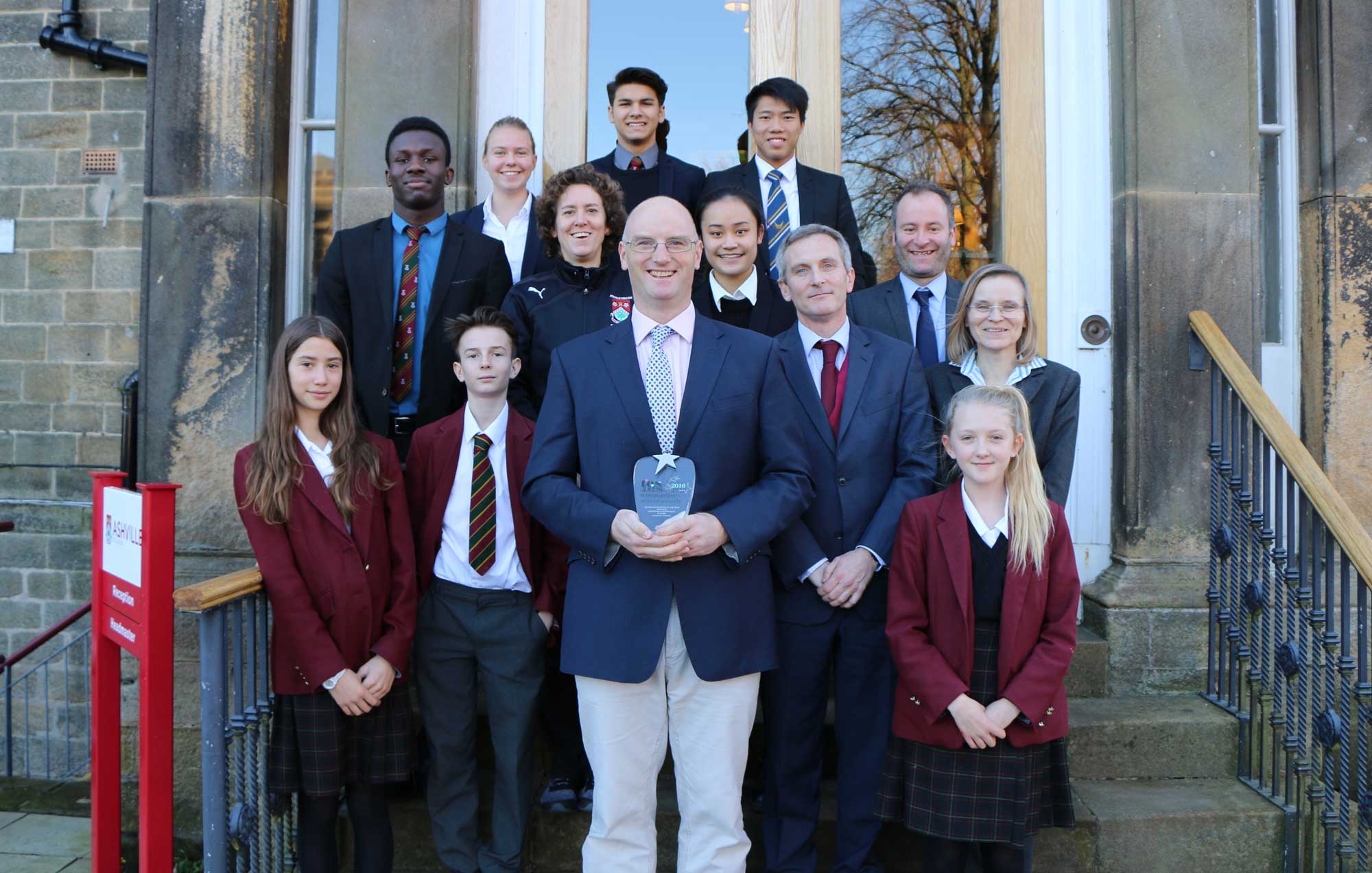 National Award! Ashville College Senior Housemaster Gilmour Coad, centre front, with boarding pupils and staff