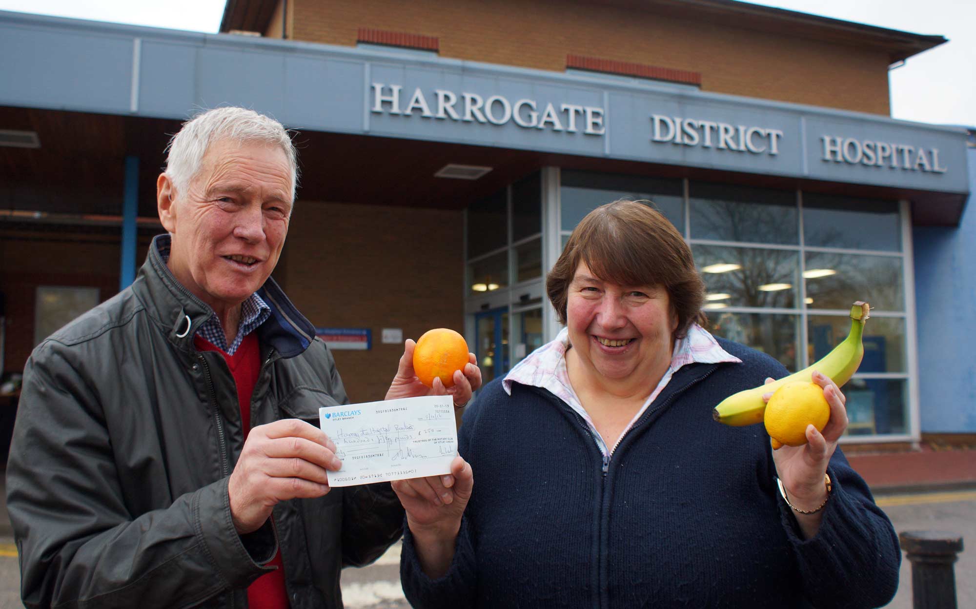 Kerching! Bill Baker from Otley Chevin Rotary Club presents a cheque for £250 to Harrogate Hospital Radio fundraiser Ellie Jackson