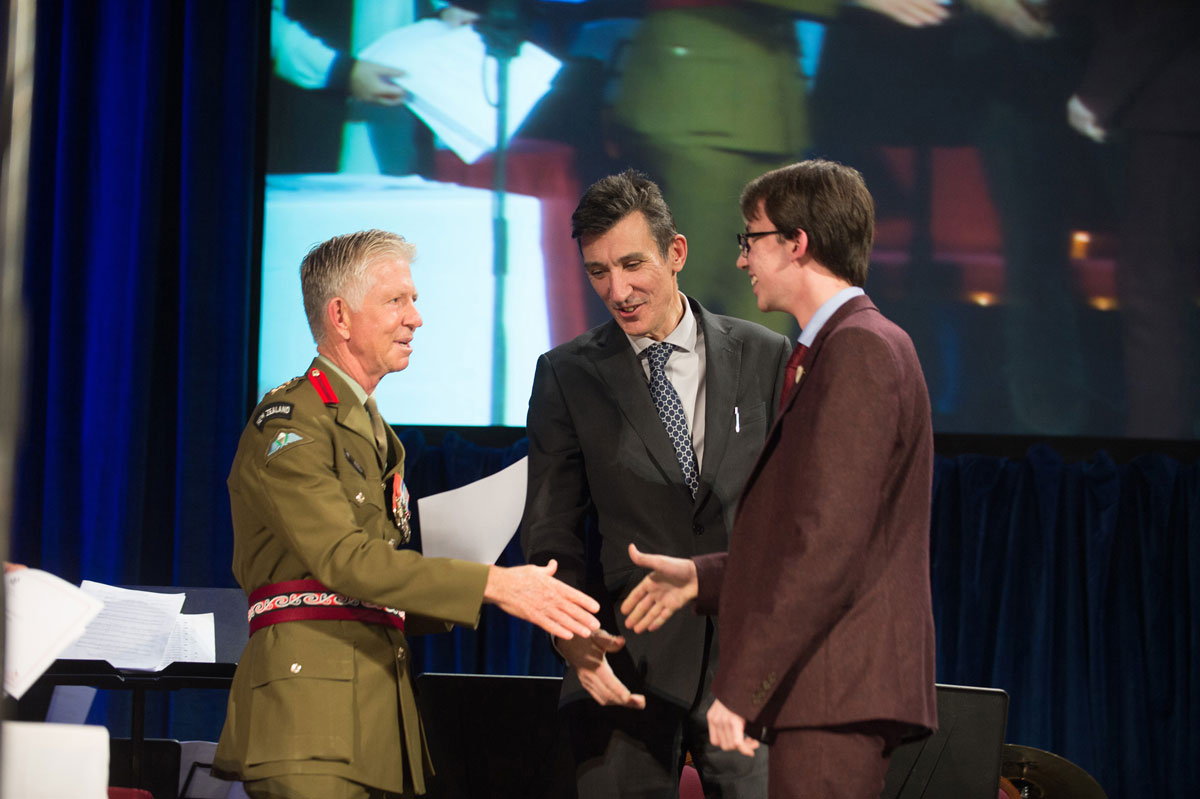 Colonel Martin Dransfield and Headteacher Richard Sheriff presenting to Deputy Head Boy Jack Hennighan