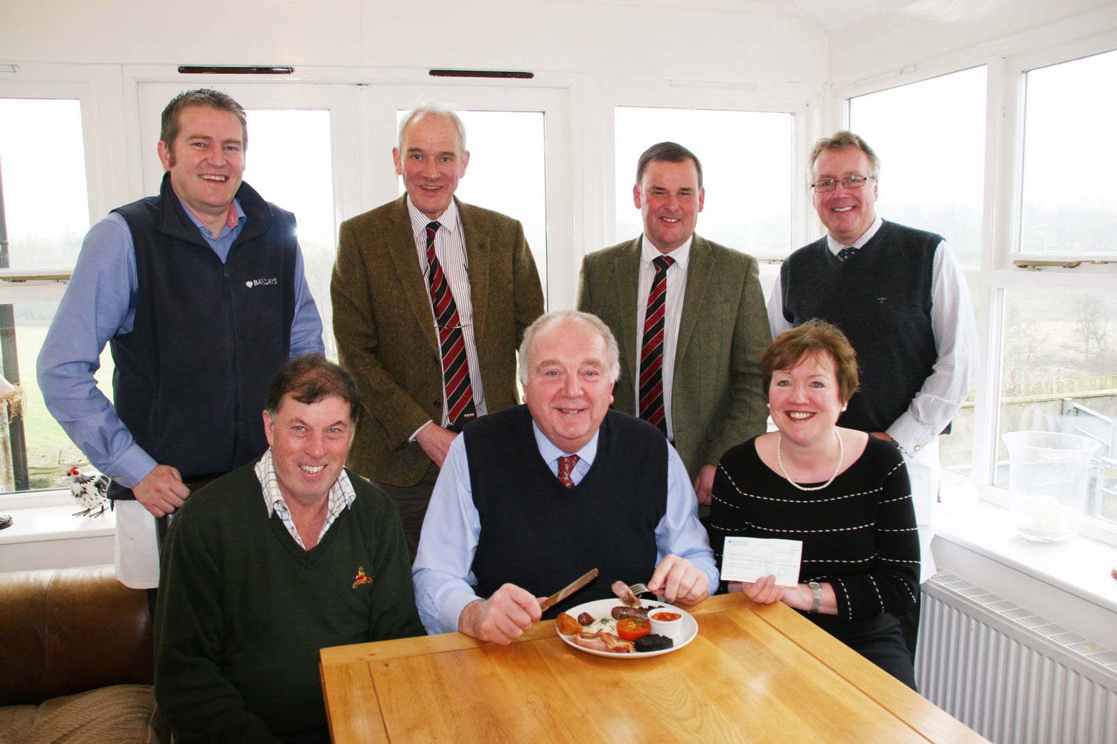 Ian Bell, chief executive of the Addington Fund, prepares to tuck into his charity breakfast, joined by hosts Chris and Christine Ryder. Standing, from left, are Barclays’ regional agricultural manager Ian Robson, Craven Cattle Marts’ general manager Jeremy Eaton, CCM director Kevin Wilson and Barclays’ regional agricultural director John Pinches