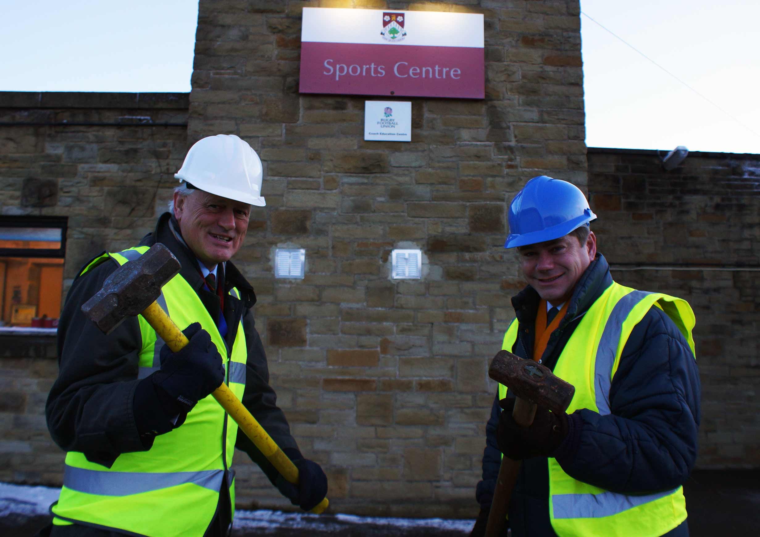 Hammer Time! Ashville’s Chairman of Governors, Peter Whitely, (left) and Headmaster Mark Lauder begin demolishing the sports centre