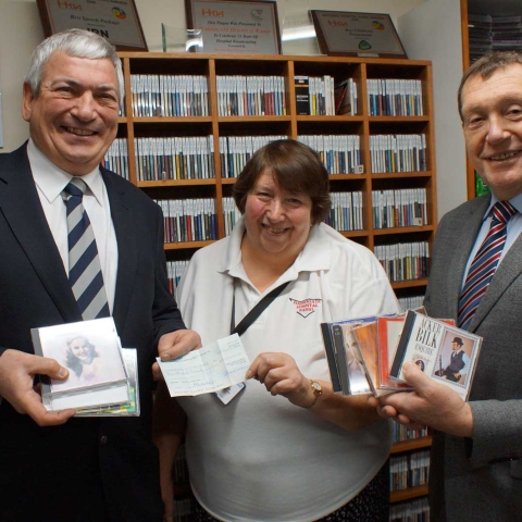 Rack & Roll! Freemasons John Birkenshaw (left) and Mike Baxter from Harrogate and Claro Lodge, present Harrogate Hospital Radio fund-raising officer Ellie Jackson with a £500 cheque for new CD storage units