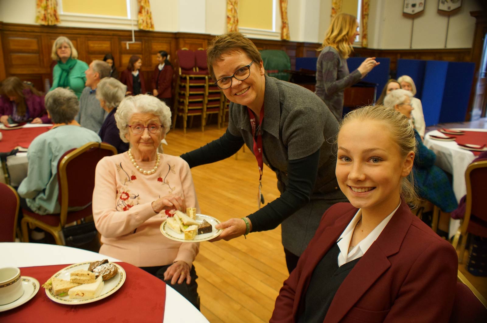 Tea for 32! Berwick Lodge Care Home resident Margaret Noble with Year 11 pupil Sophie Rastrick and Catherine Frieze, Ashville College’s volunteer co-ordinator