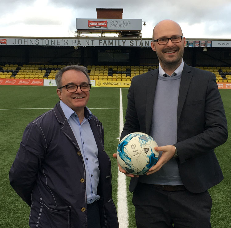 Harrogate Town Managing Director Garry Plant with McCormicks Corporate Partner Lewis Goodwin