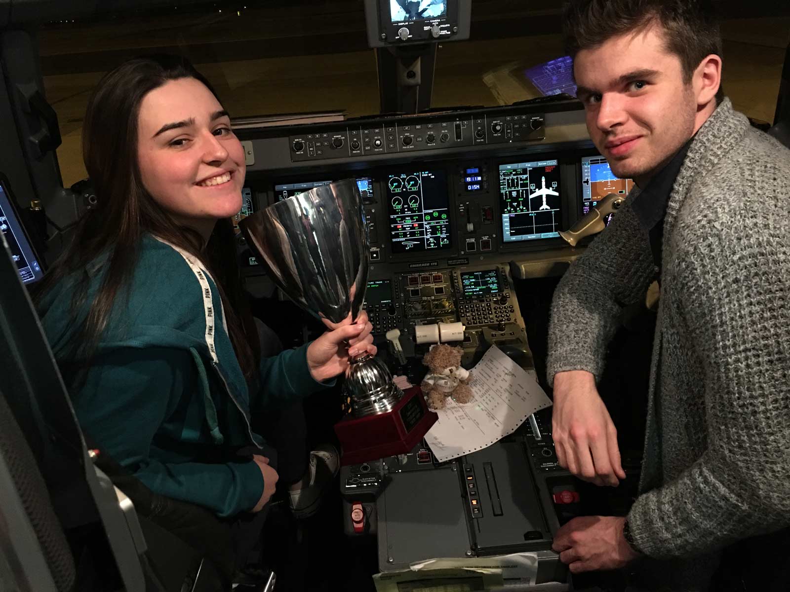 Flying Finish! Ashville Swimming captains James Sadler and Rosie Rudolph in the cockpit before flying home with the European Trophy