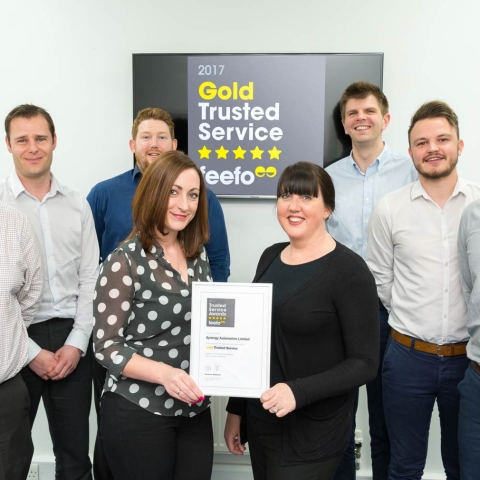 Synergy Automotive team members celebrate Feefo success