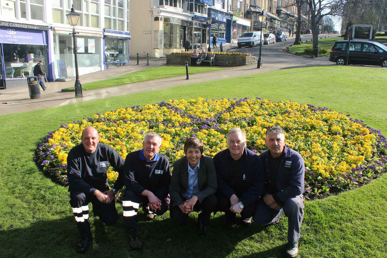 Tour de Yorkshire wheel flower bed: Gary Tulip (Gardener), Glenn Brookes (Gardener) Sue Wood (HBC Horticultural Officer), Barrie Stringer, (Harlow Hill Nursery Operations Manager) and Steve Metcalfe (Gardener)