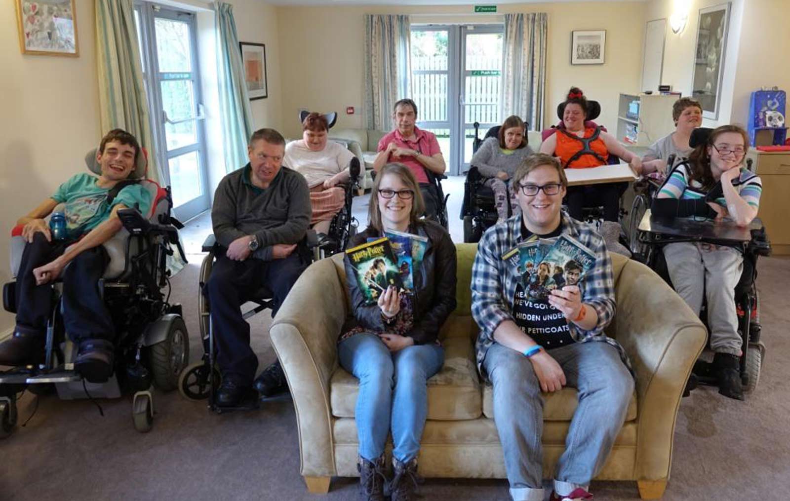 Kirsty Dodge and Tim Henton (front seated) with some of the residents living at Disability Action Yorkshire’s Claro Road care home