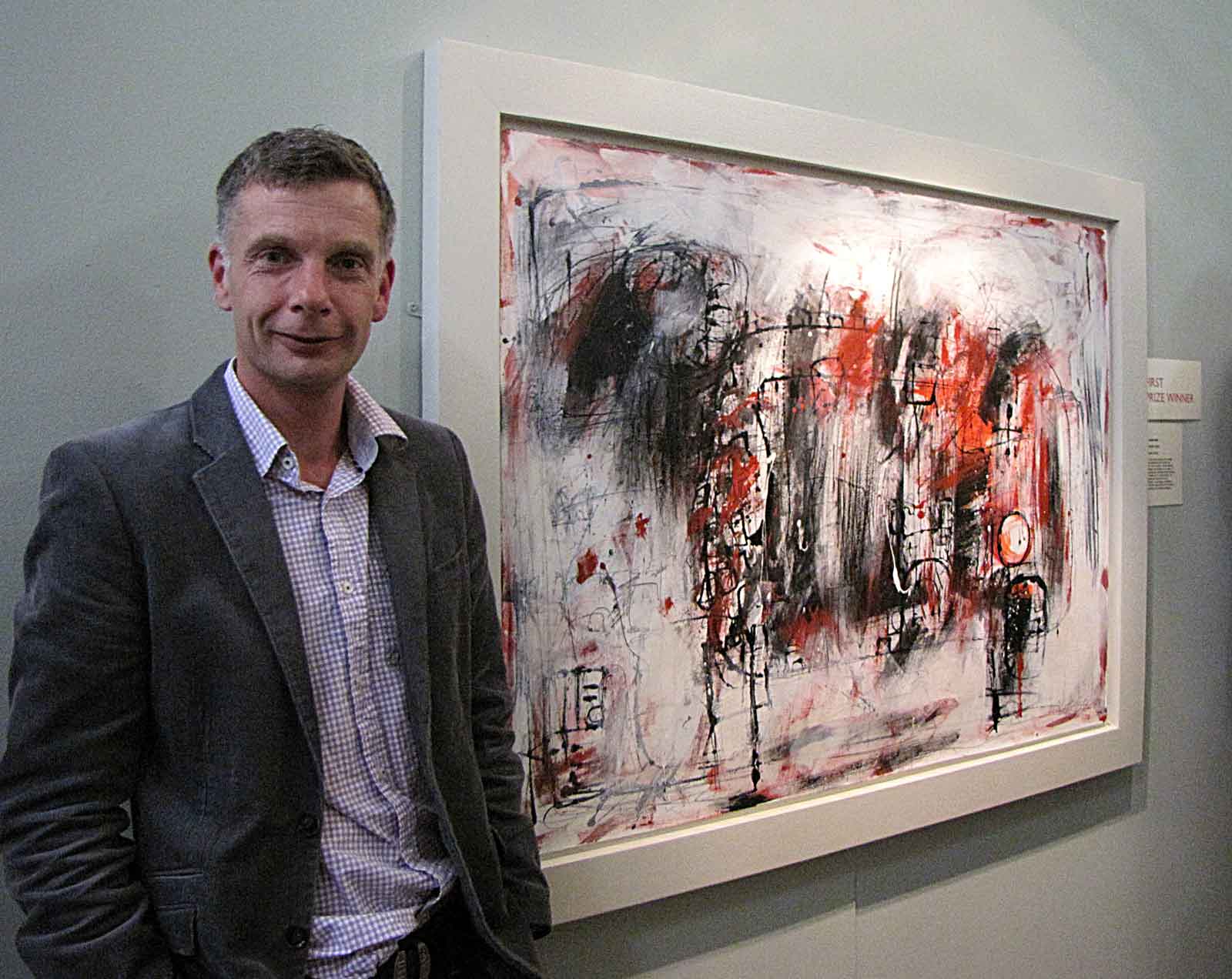 Adam King, first prize winner at the Harrogate Open in 2010, with his painting ‘The Scapegoat’ which is now in the Mercer collection