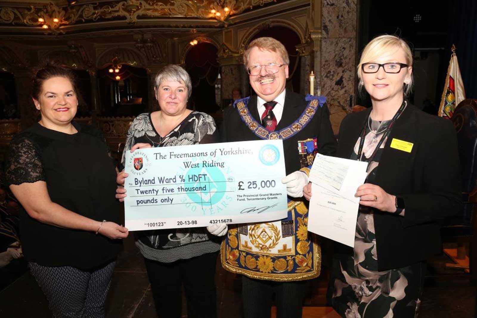 Major Contribution! The Provincial Grandmaster for the Province of Yorkshire West Riding, David S Pratt, with Byland Ward representatives Tammy Gotts, Adele Dungey and Tracy Campbell