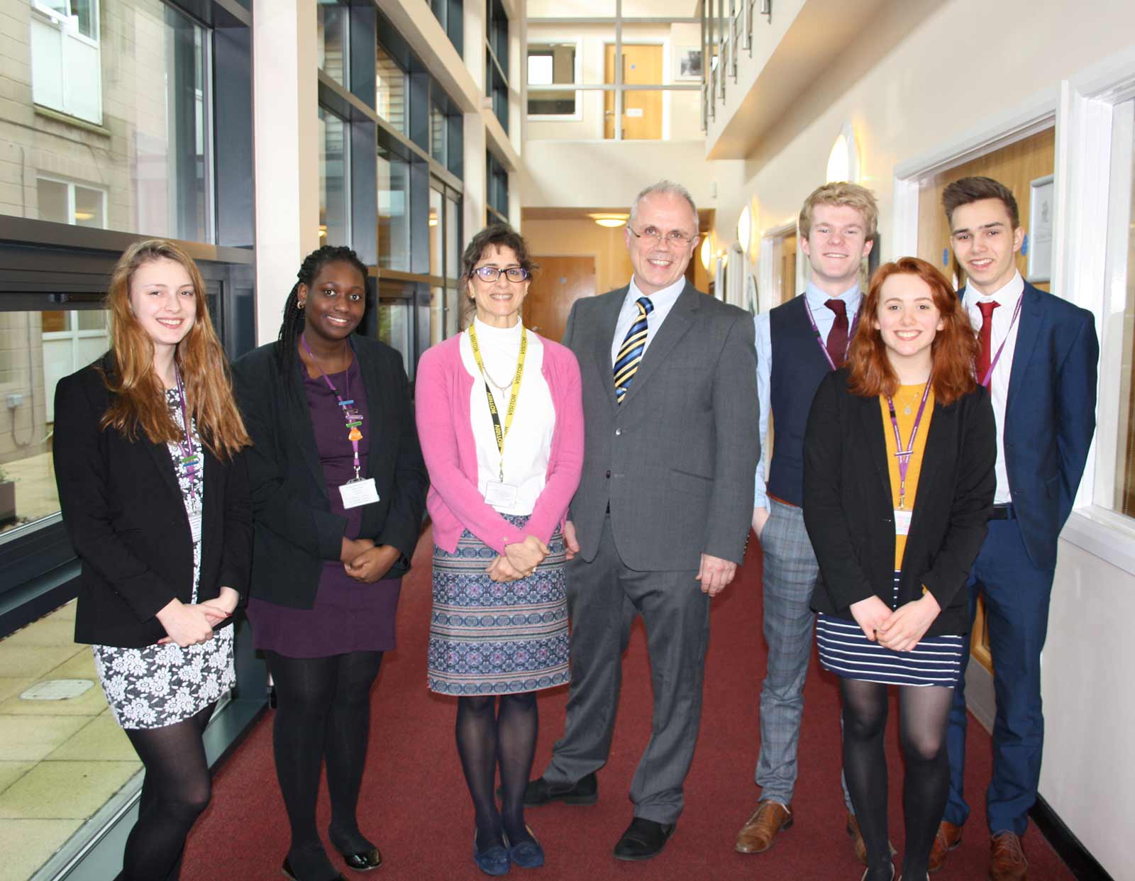 Year 12 students - Kate Watson and Mam Jallow, Former Head Girl - Michelle Mohajer, Former Head Boy – Alistair Gibb, students – George Kendall, Ellen Young and Owen Jones