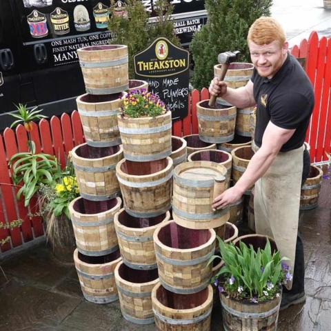 A Must Have For Beer & Gardening Fanatics! Theakston’s apprentice cooper Euan Findlay with the garden planters he has made from cast off beer casks