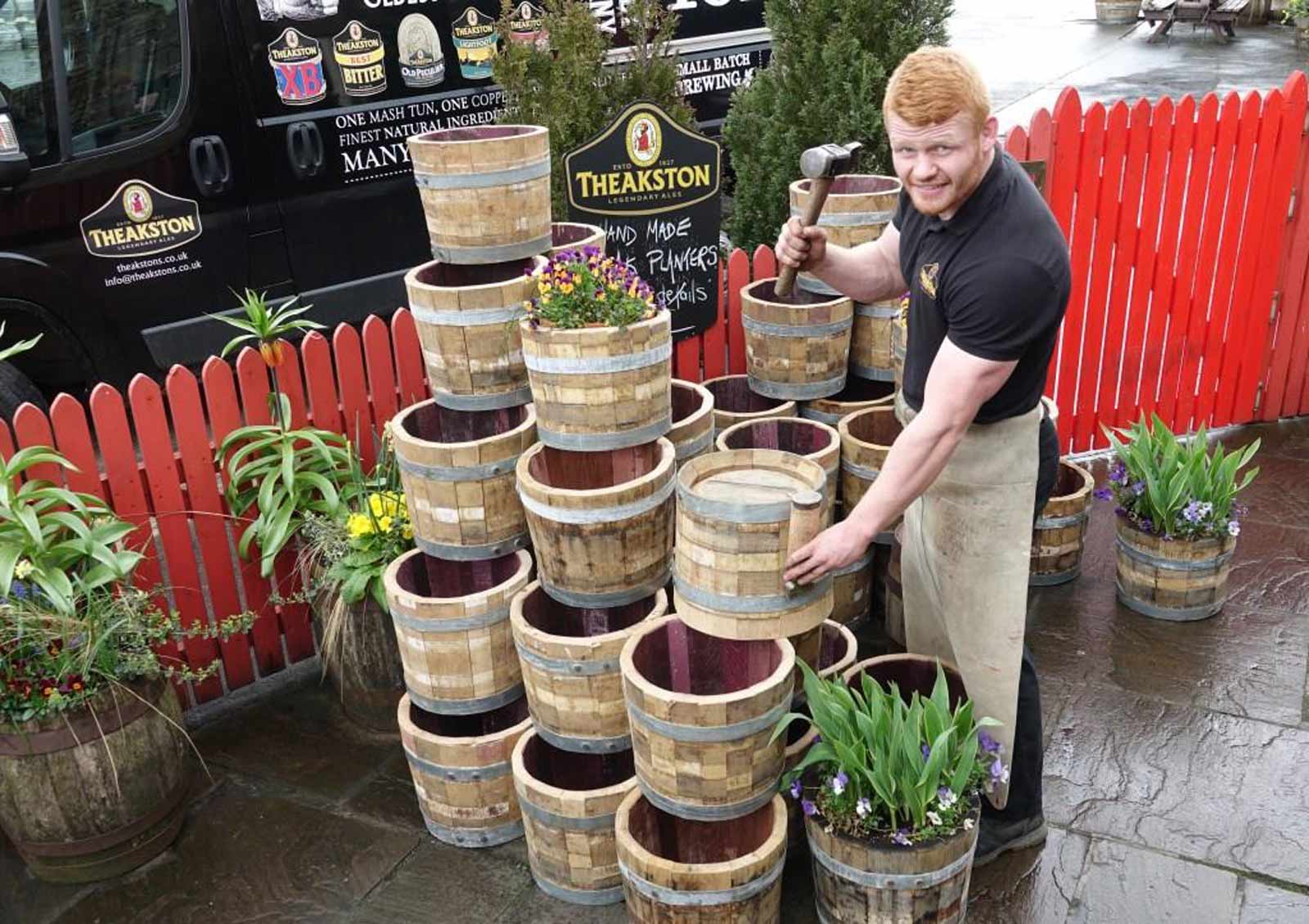 A Must Have For Beer & Gardening Fanatics! Theakston’s apprentice cooper Euan Findlay with the garden planters he has made from cast off beer casks