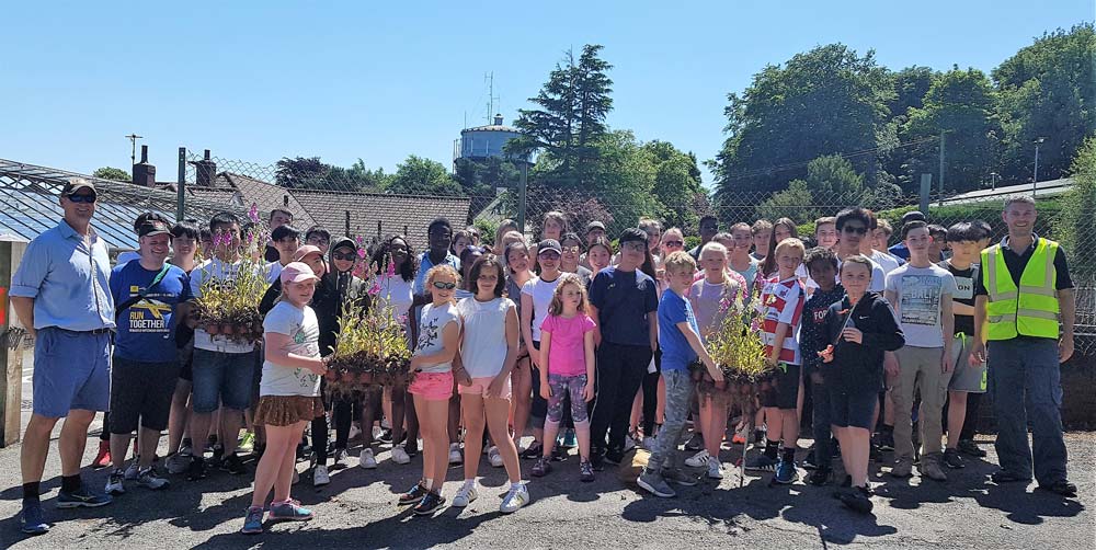 Community Service! Ashville College boarders, teaching staff and members of the Pinewoods Conservation Group ahead of an afternoon of planting, litter picking and balsam bashing