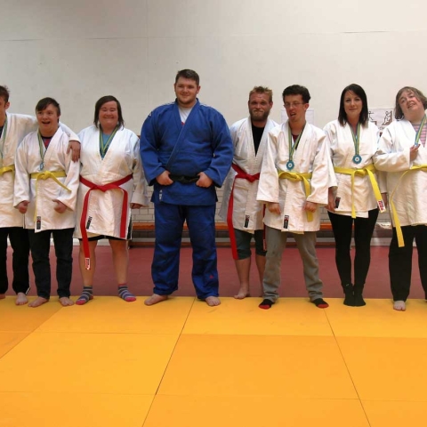 Dermot-Heslop-(far-left)-and-Jack-Hodgson-(centre)-with-students-and-staff-from-Henshaws-Specialist-College