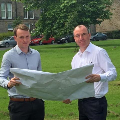 Councillor Tim Myatt (left) and Councillor Richard Cooper examining plans for the mast at the proposed site