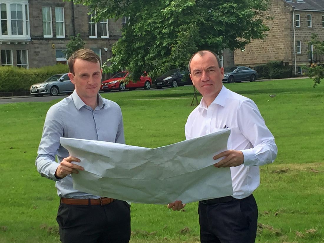 Councillor Tim Myatt (left) and Councillor Richard Cooper examining plans for the mast at the proposed site