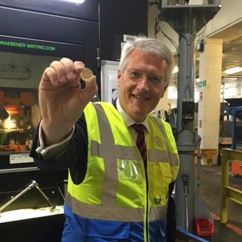 Andrew Jones mints the billionth new pound coin
