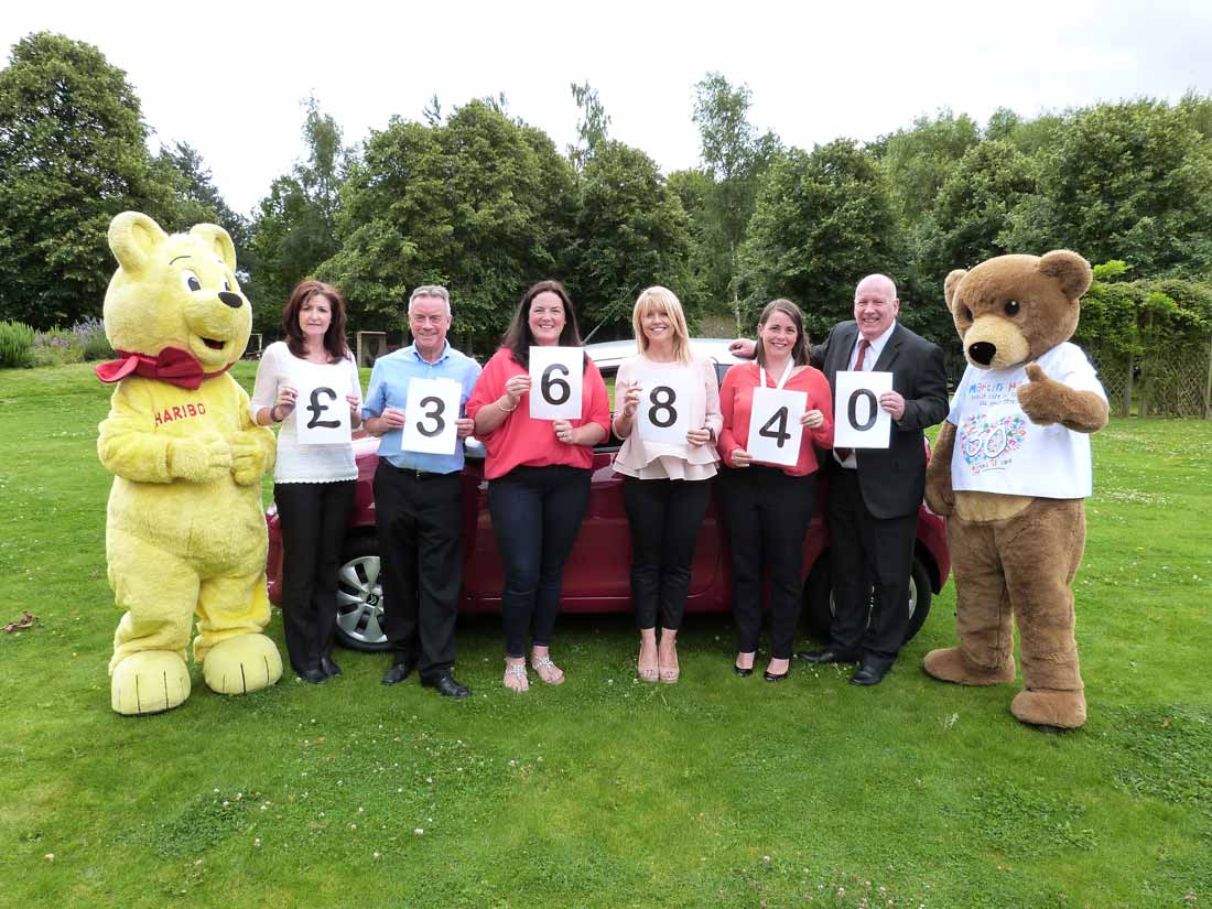 Julie Beaman of HARIBO, Martin House corporate fundraiser John Haigh, car winner Anna Byrom, Calendar’s Christine Talbot, director of fundraising Jodie Shepherd and Peter Dean of Evans Halshaw Citroen Leeds